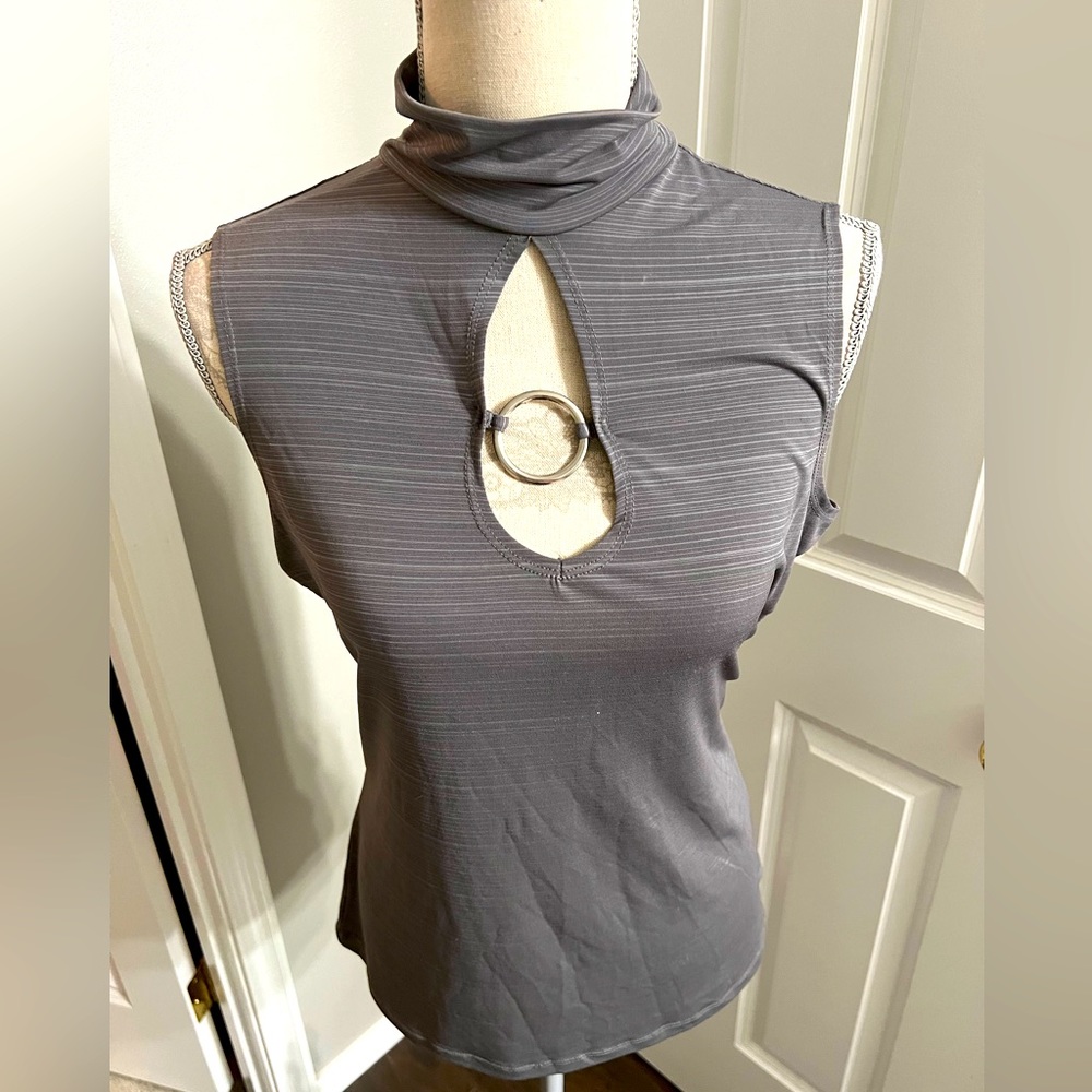 Sleeveless soft grey blouse w/silver accent!